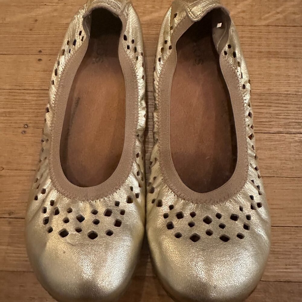 Taos gold slip ons